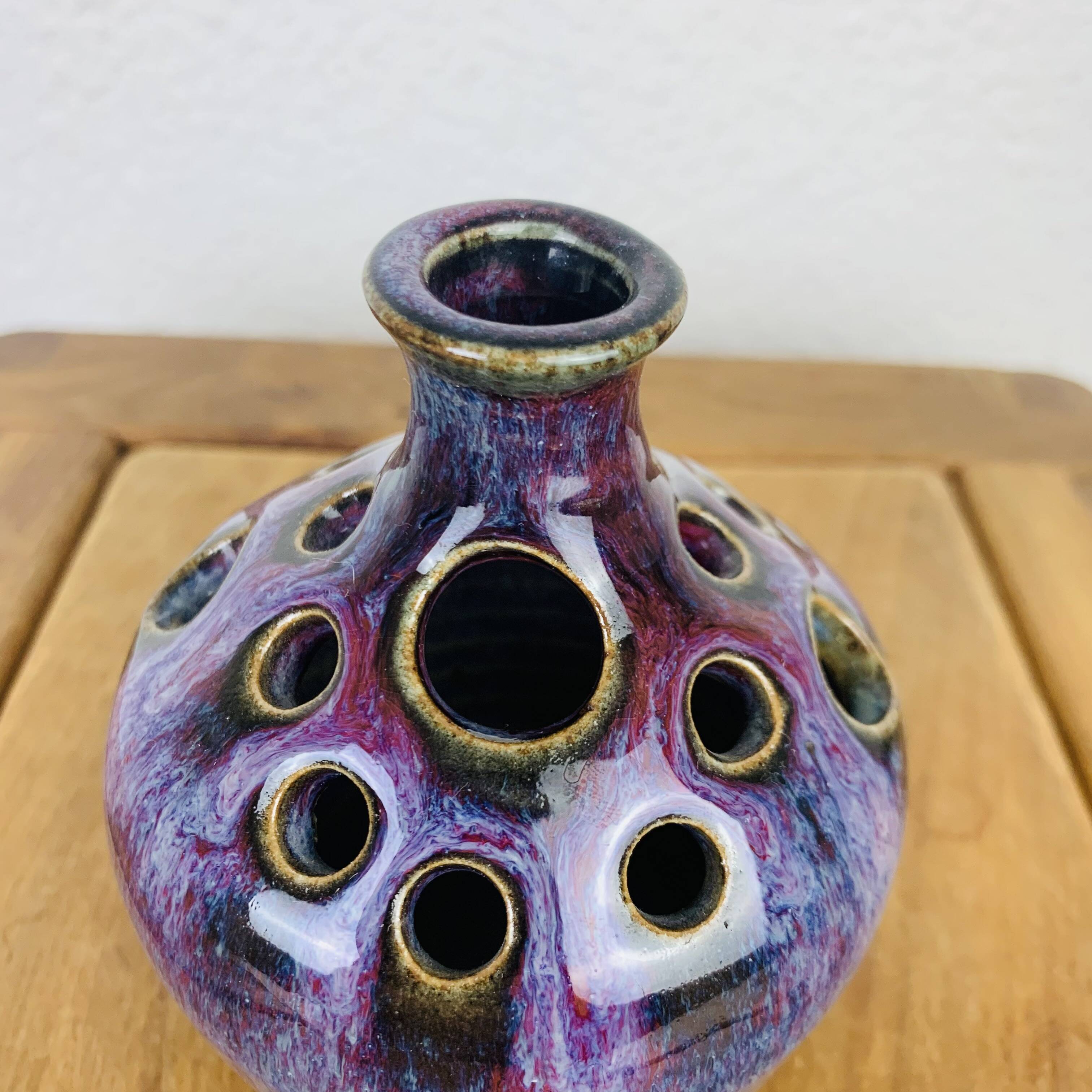 Vase with purple ceramic flowers