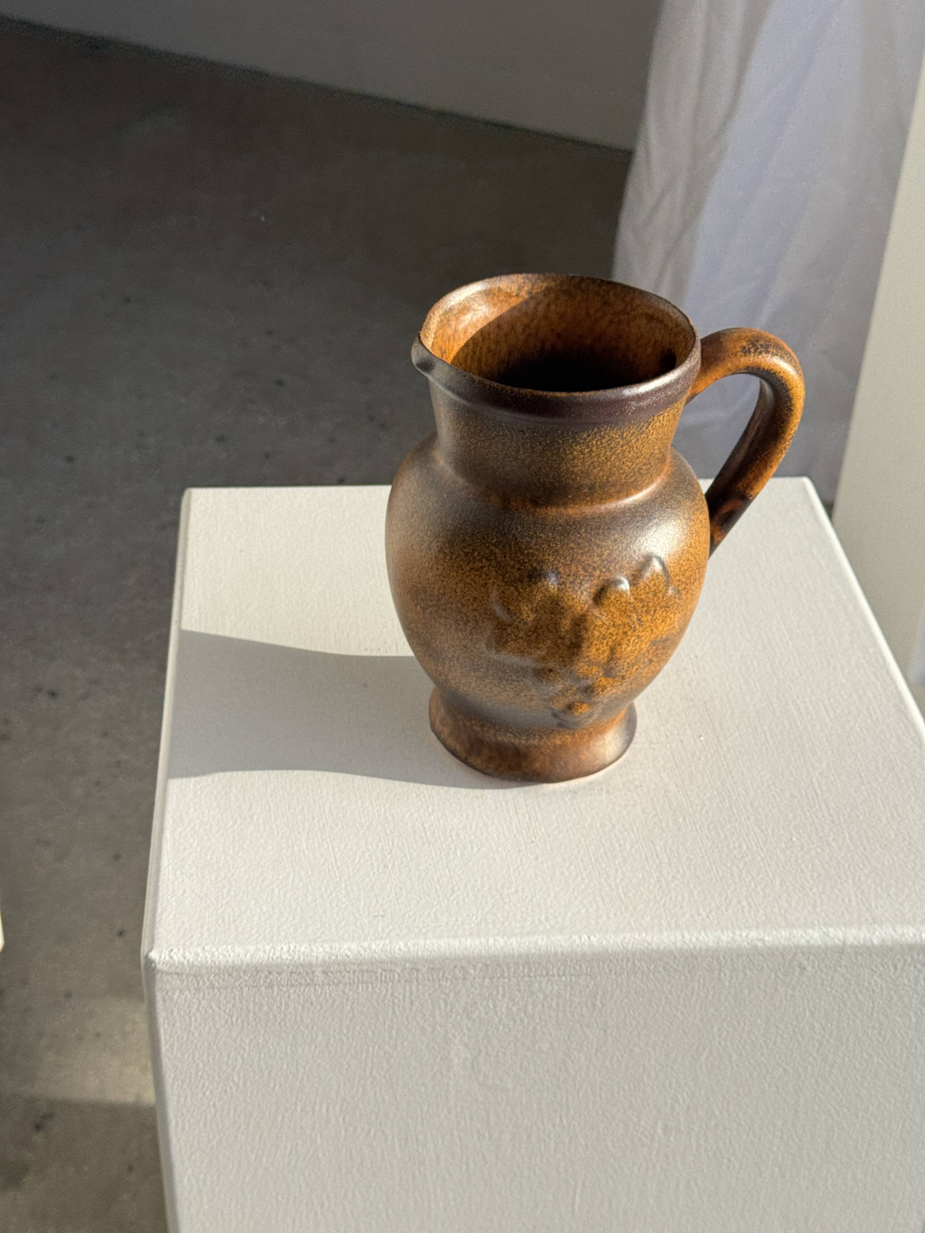 Speckled stoneware jug with grape pattern H17