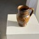 Speckled stoneware jug with grape pattern H17