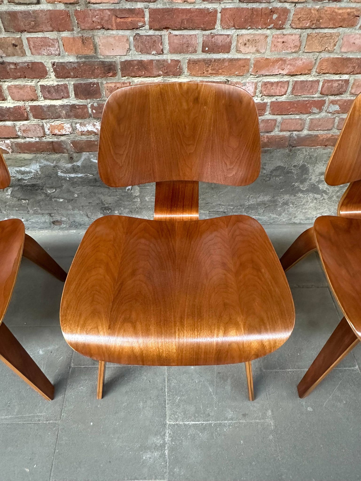 Set of 4 DCW chairs in walnut, Charles & Ray Eames, Herman Miller, 1950s