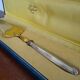Antique silver and gilded metal pie shovel in case