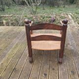 Low straw fireplace armchair in Dudouyt style