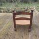 Low straw fireplace armchair in Dudouyt style