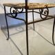 Wrought iron chair with woven seat