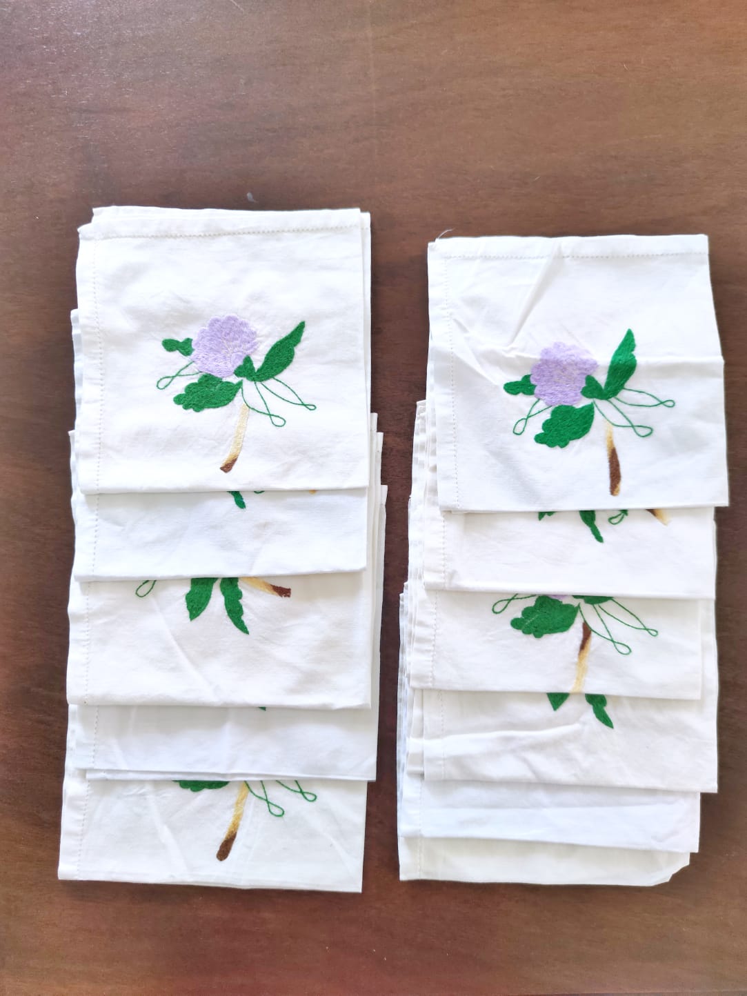 11 hand-embroidered antique table towels