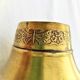 Vase in brass worked with flowers and butterflies around 1930