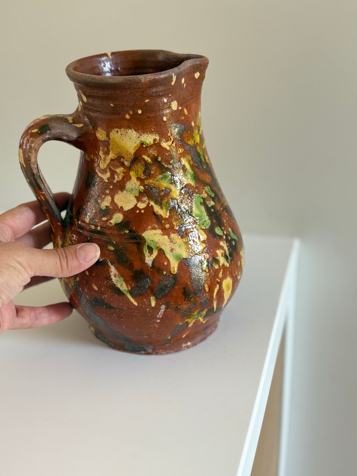 Studio ceramic pitcher with sprayed glazes – circa 1960-70