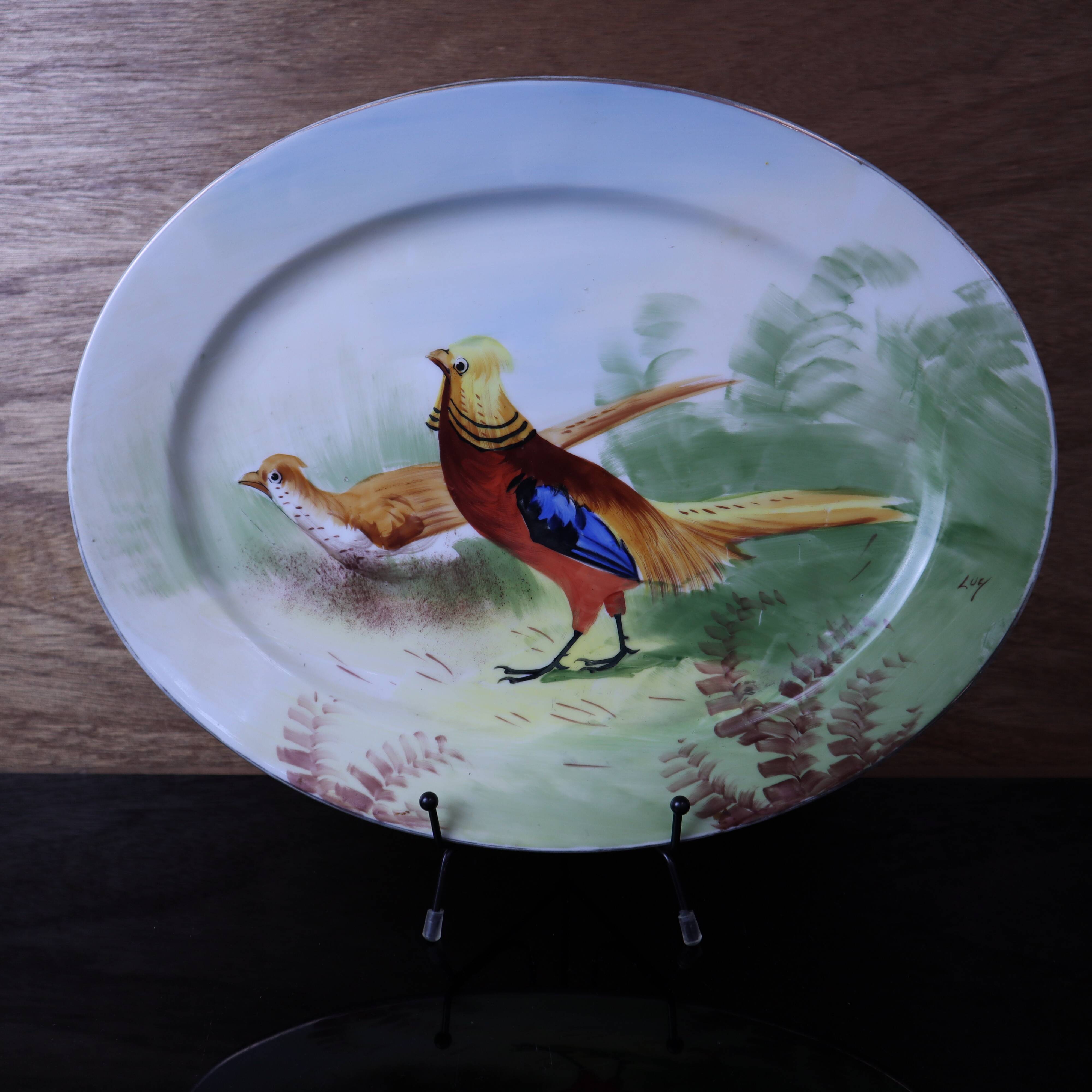 Antique large oval Limoges porcelain dish with painted pheasant decoration.