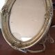 Golden oval frame XXth