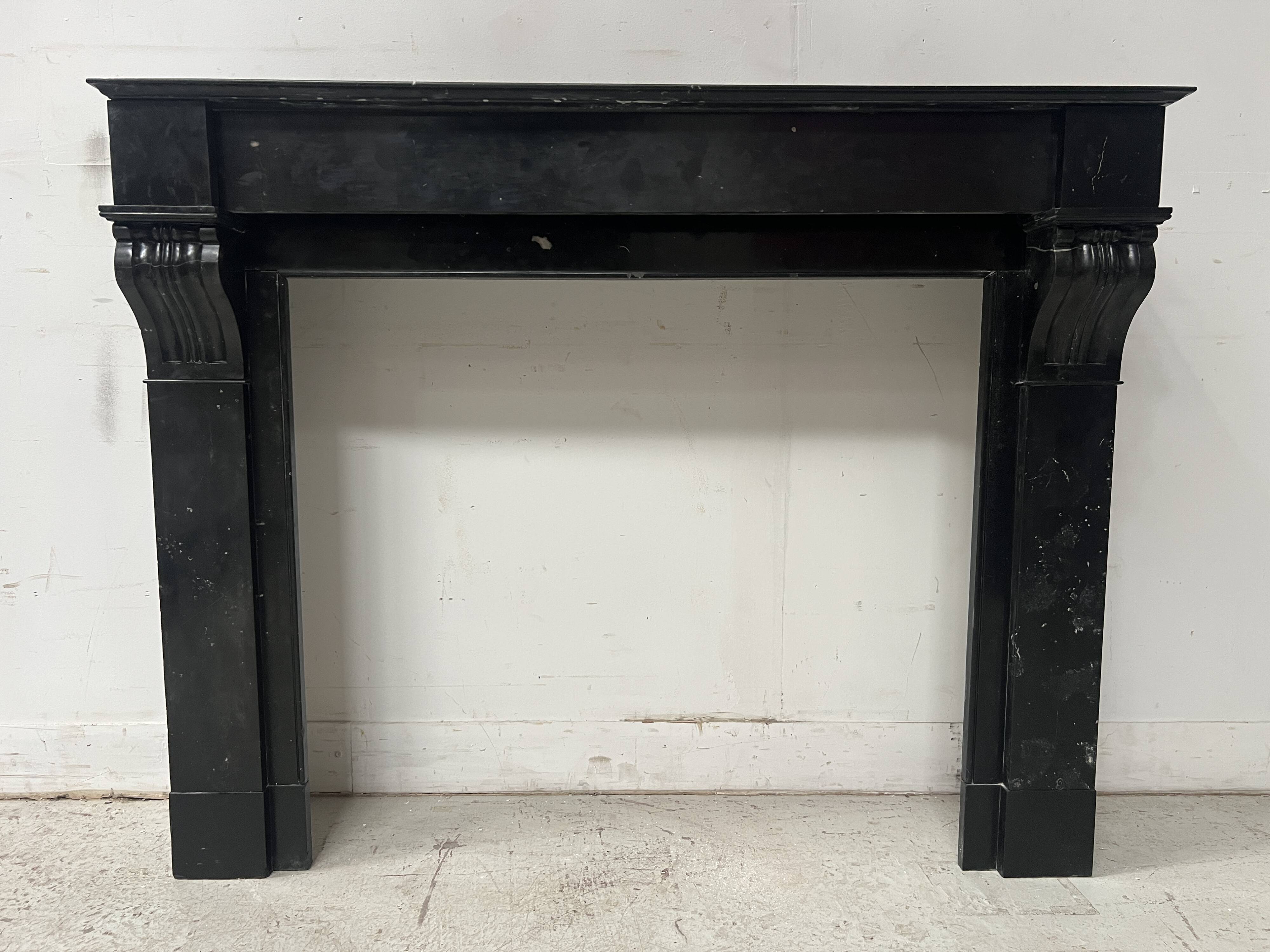 Napoleon III period fireplace with a black marble corbel. 19th century.