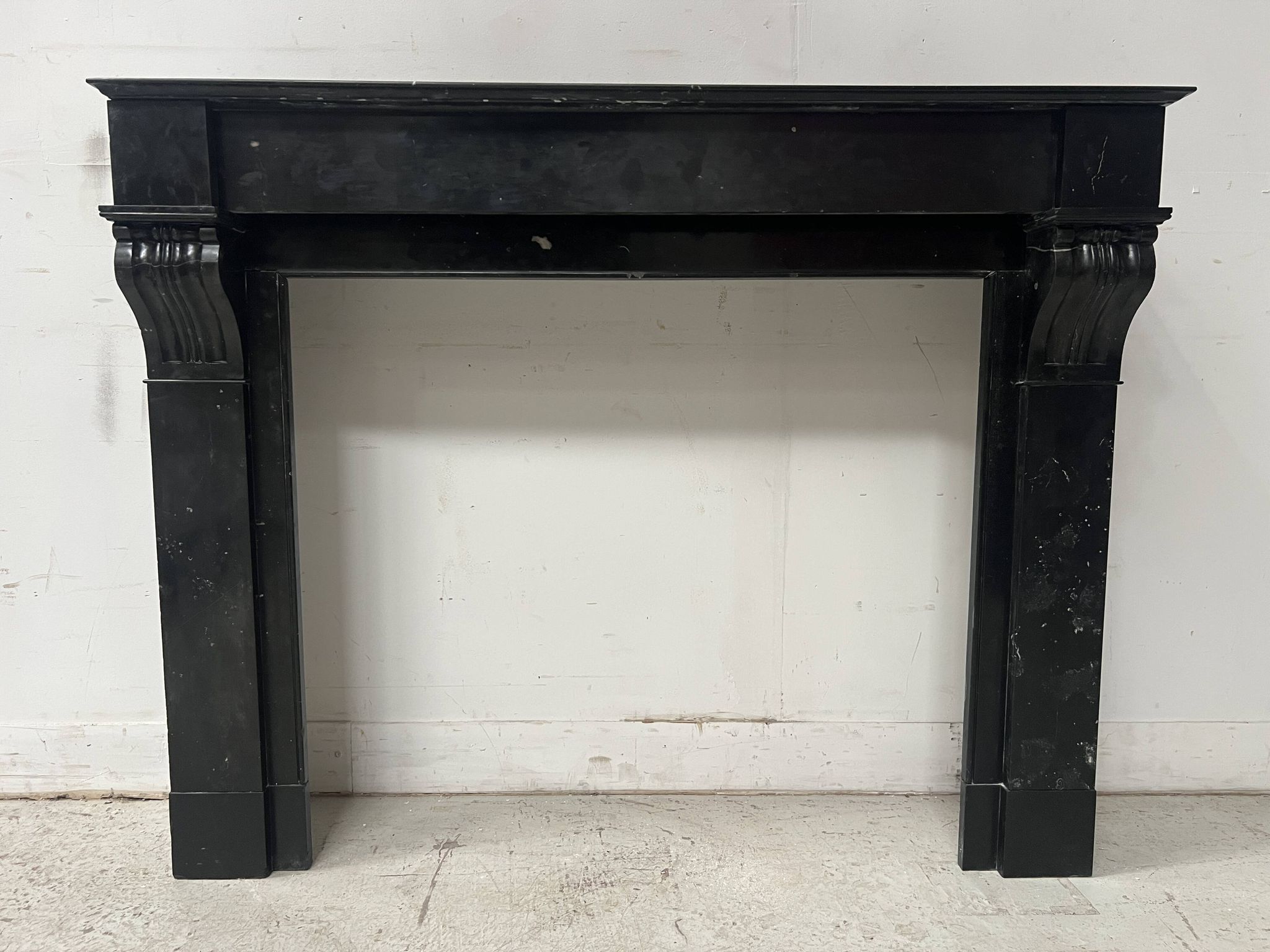 Napoleon III period fireplace with a black marble corbel. 19th century.