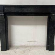 Napoleon III period fireplace with a black marble corbel. 19th century.