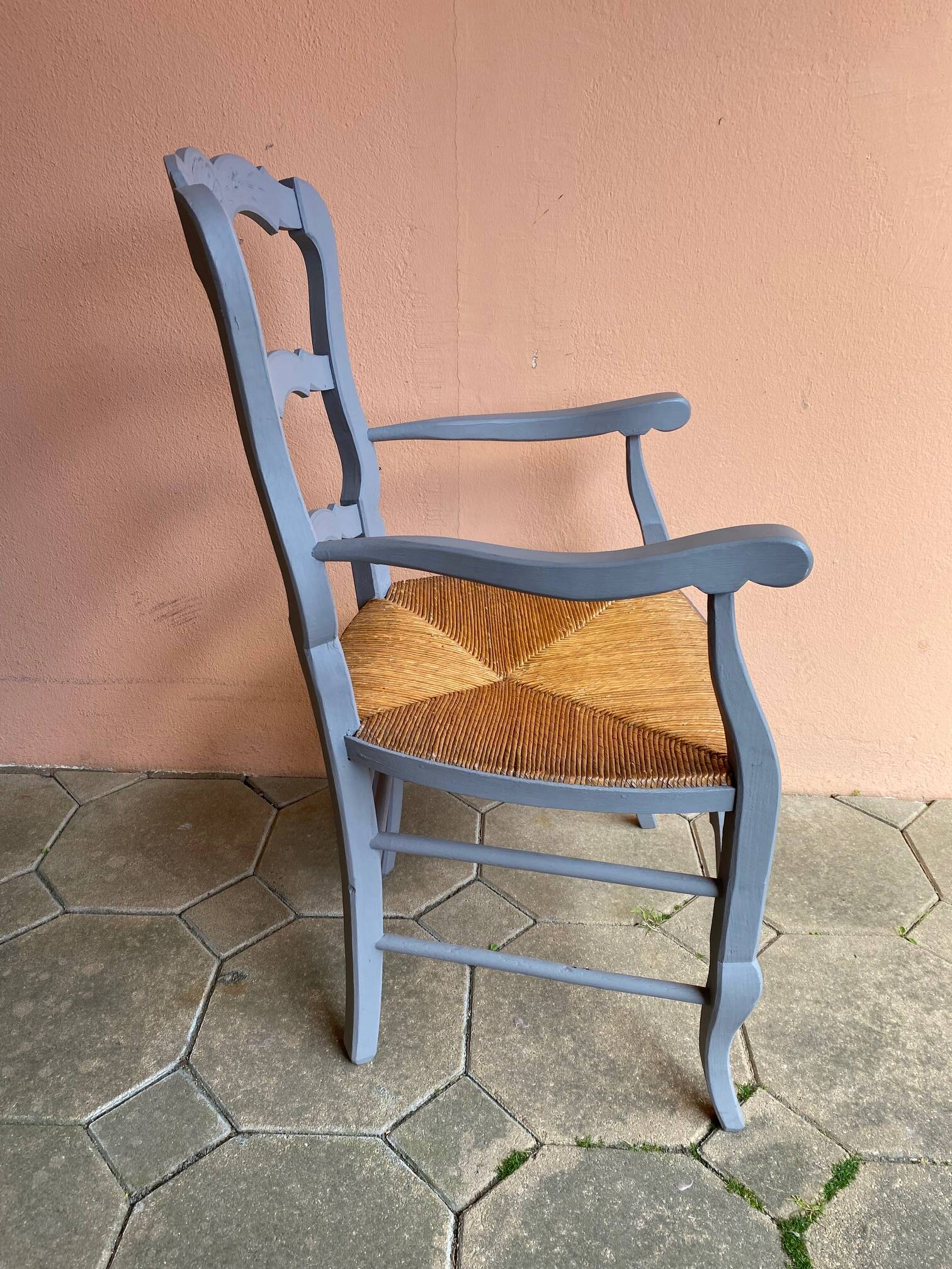 Provencal style straw armchair with gray blue patina armrests