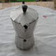 Italian coffee maker in aluminum grip in bakelite
