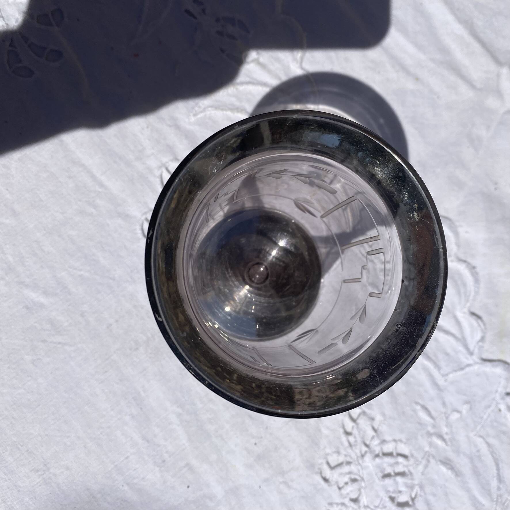 Antique Art Deco engraved glass, silvered rim and base.