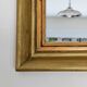 Antique mirror in gilded and copper wood