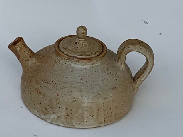 Vintage teapot in reeds