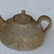 Vintage teapot in reeds