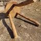 Rustic three-legged stool in minimalist wood in the style of Touret.