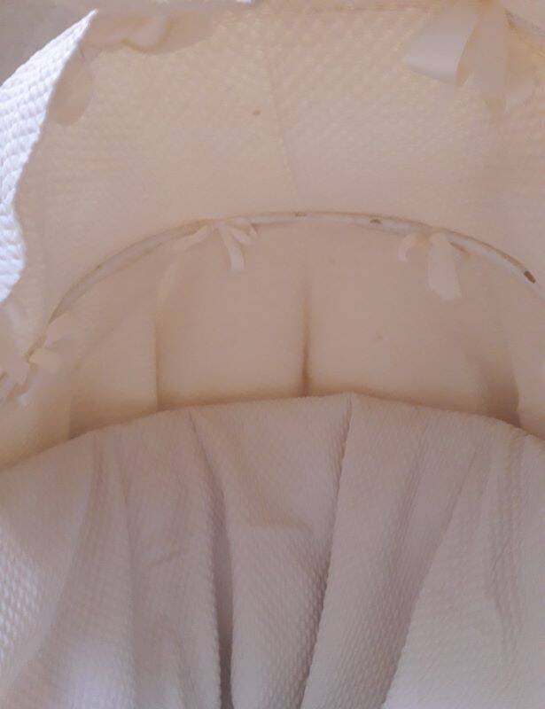 Wicker and painted wood baby cradle