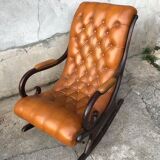 Rocking chair In studded orange leather Chesterfield