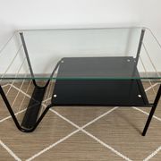 Metal and glass coffee table with magazine rack by Roche Bobois from the 1950s.