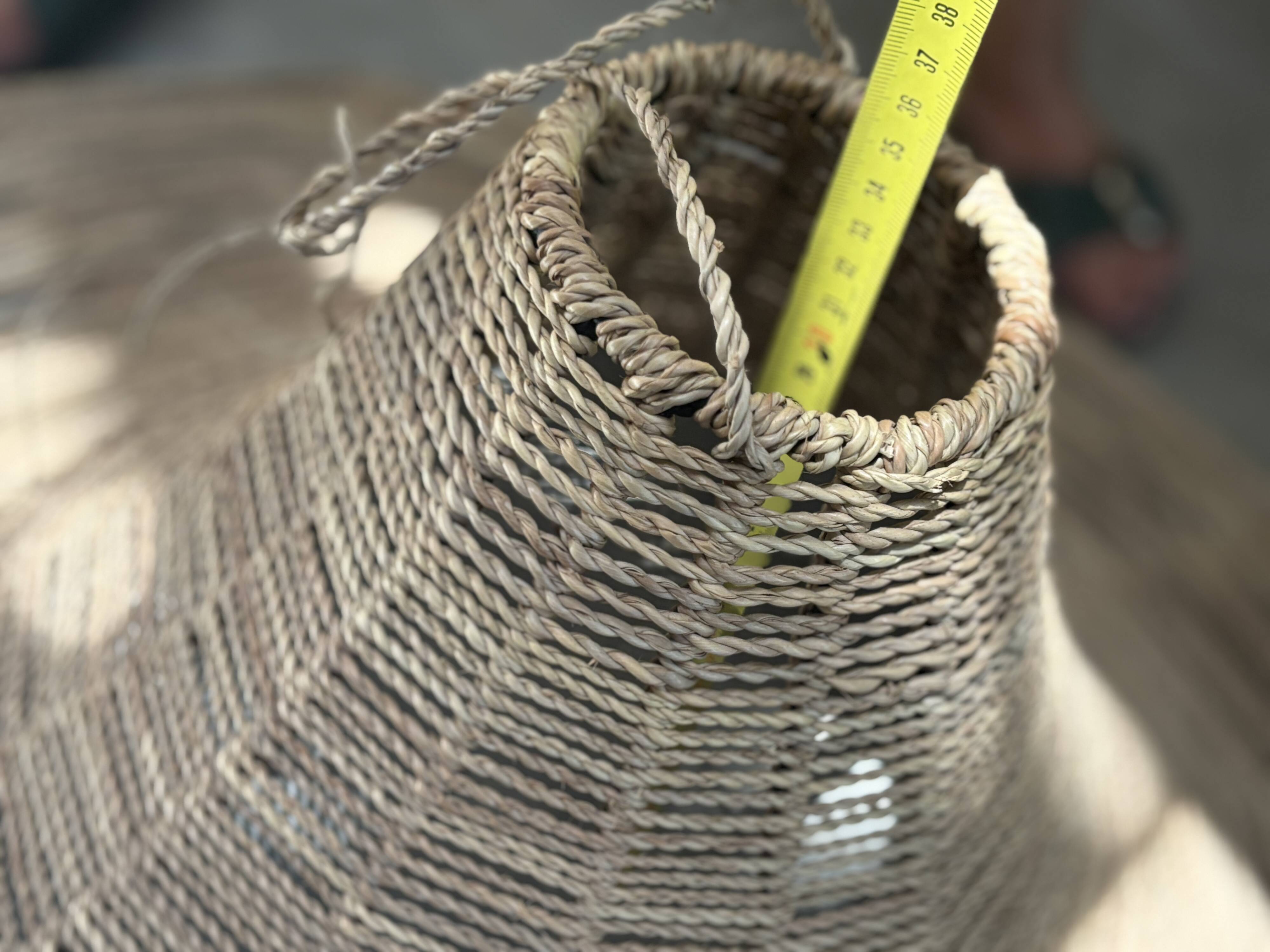 Large lampshade made of woven ropes.