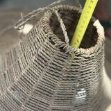 Large lampshade made of woven ropes.