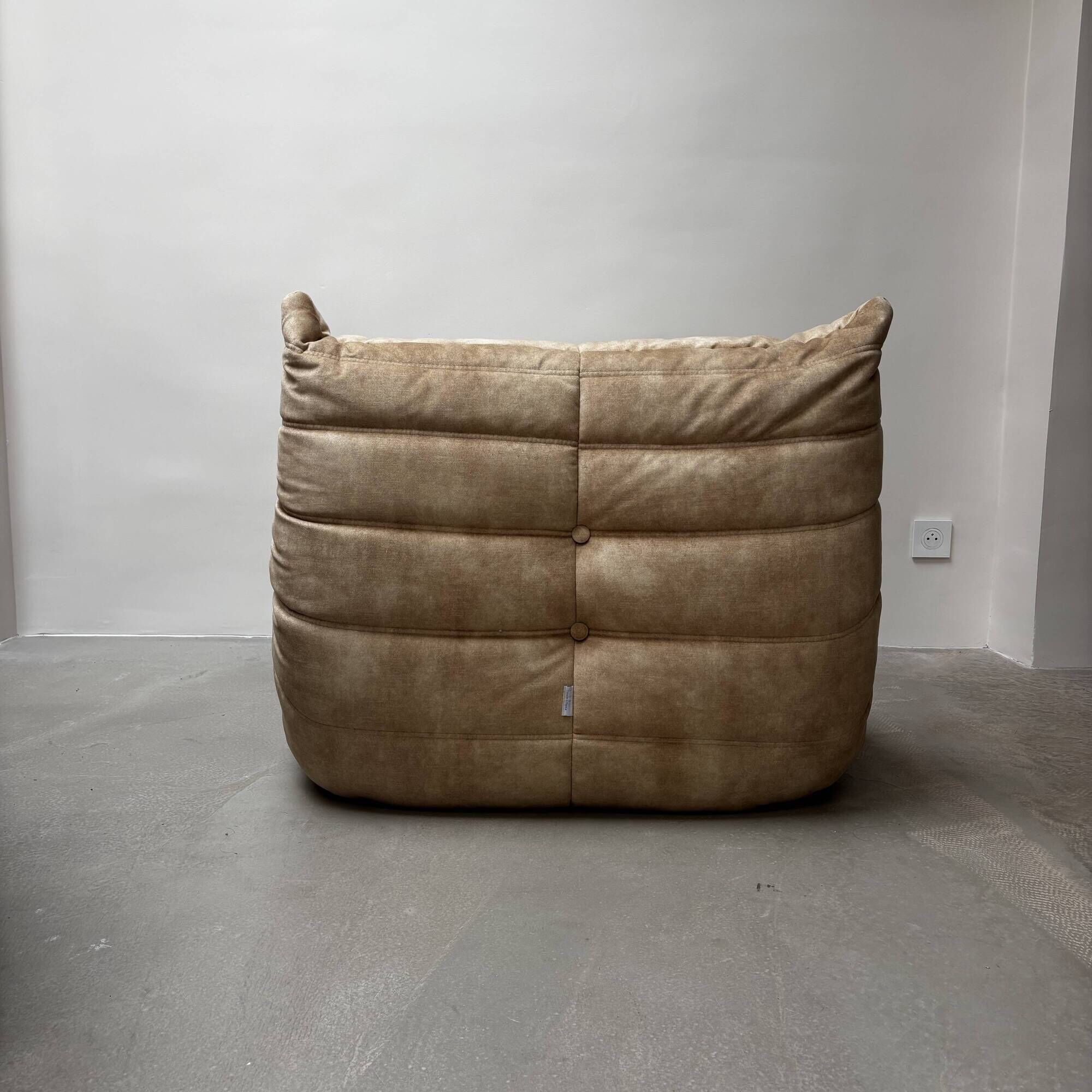 Amber beige Togo armchair by Michel Ducaroy for Ligne Roset.