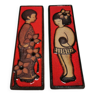 Long Søholm relief in beautiful red glaze with a motif of a girl and a boy