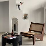 Reclined armchair in canned teak in natural wood