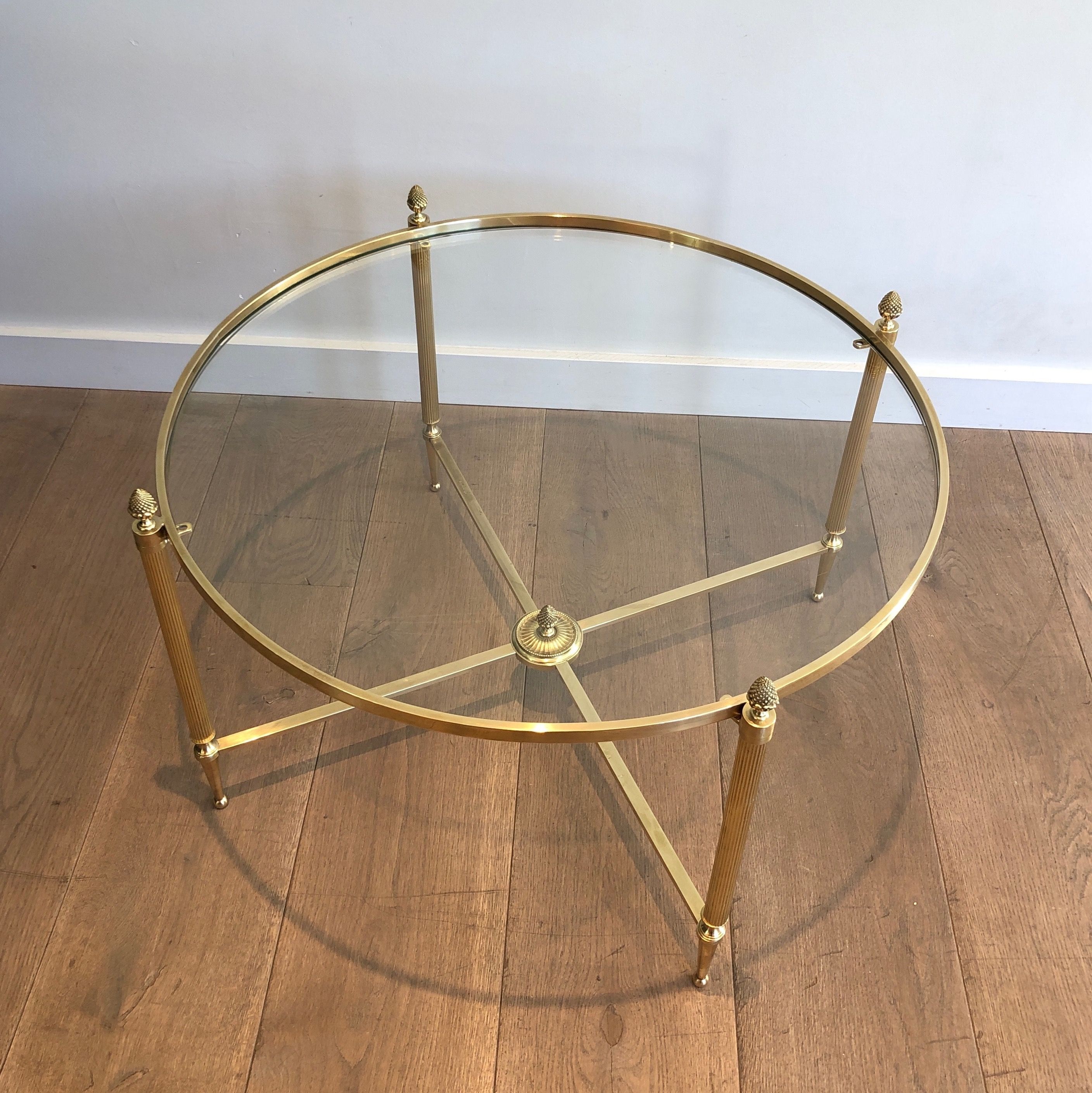 Round brass coffee table. Maison Baguès