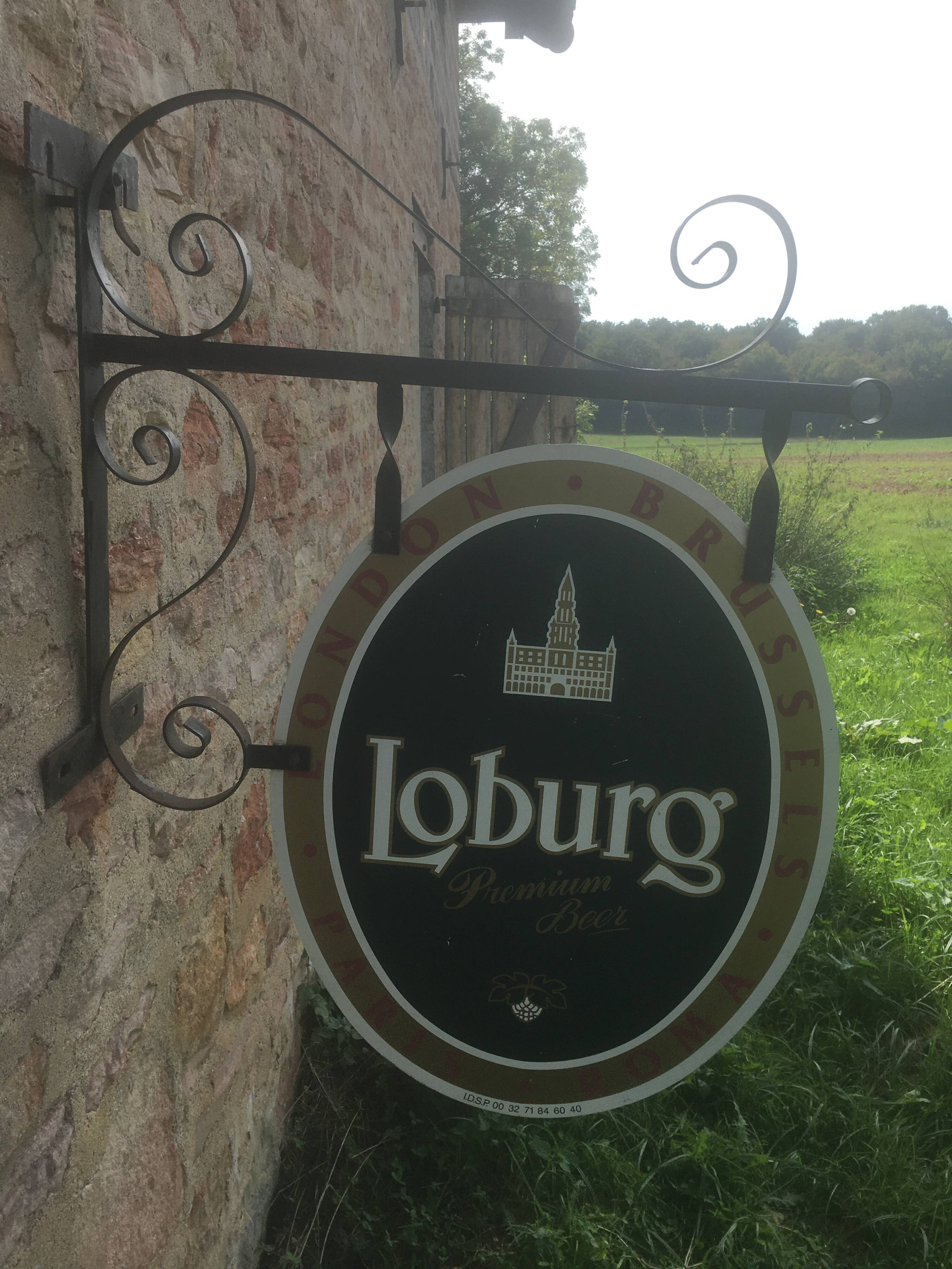 Double-sided "Loburg Beer" metal sign on wrought iron bracket