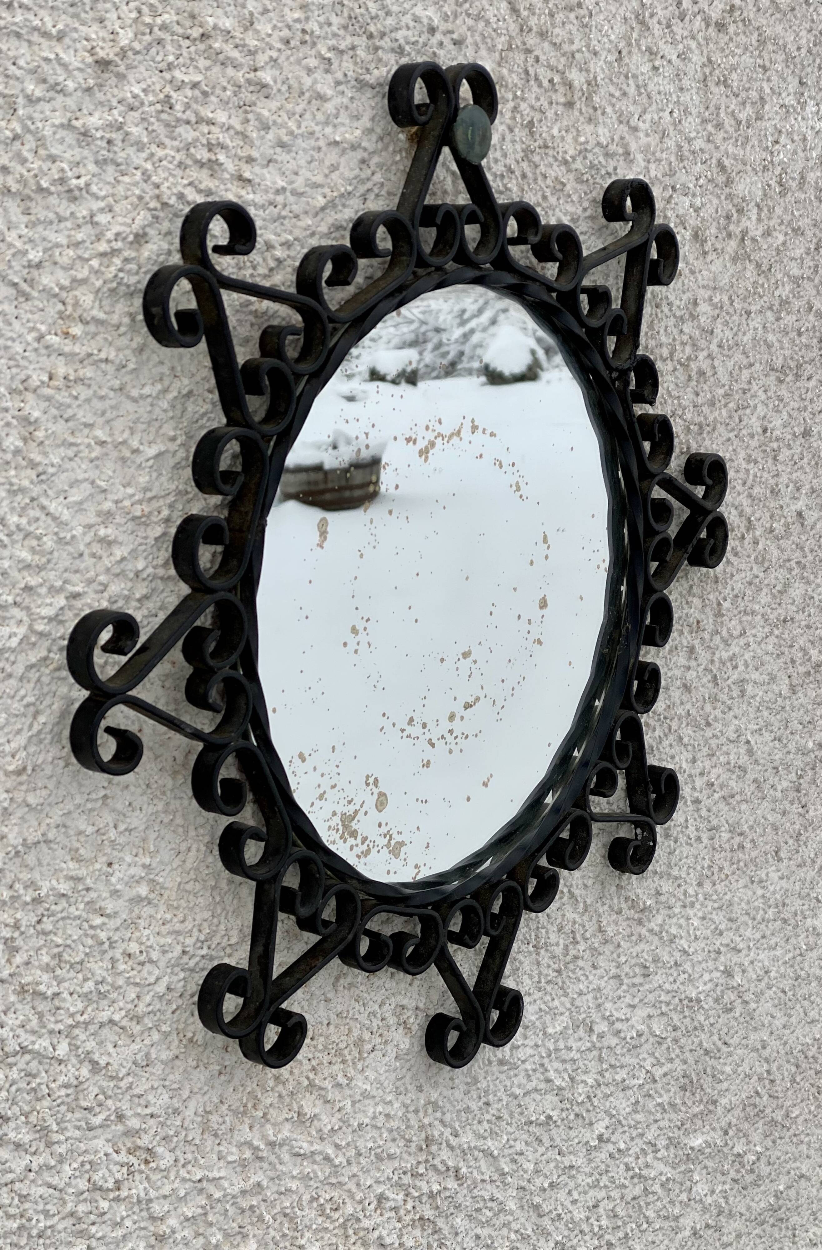 Vintage 1950s round metal mirror in the style of Chaty