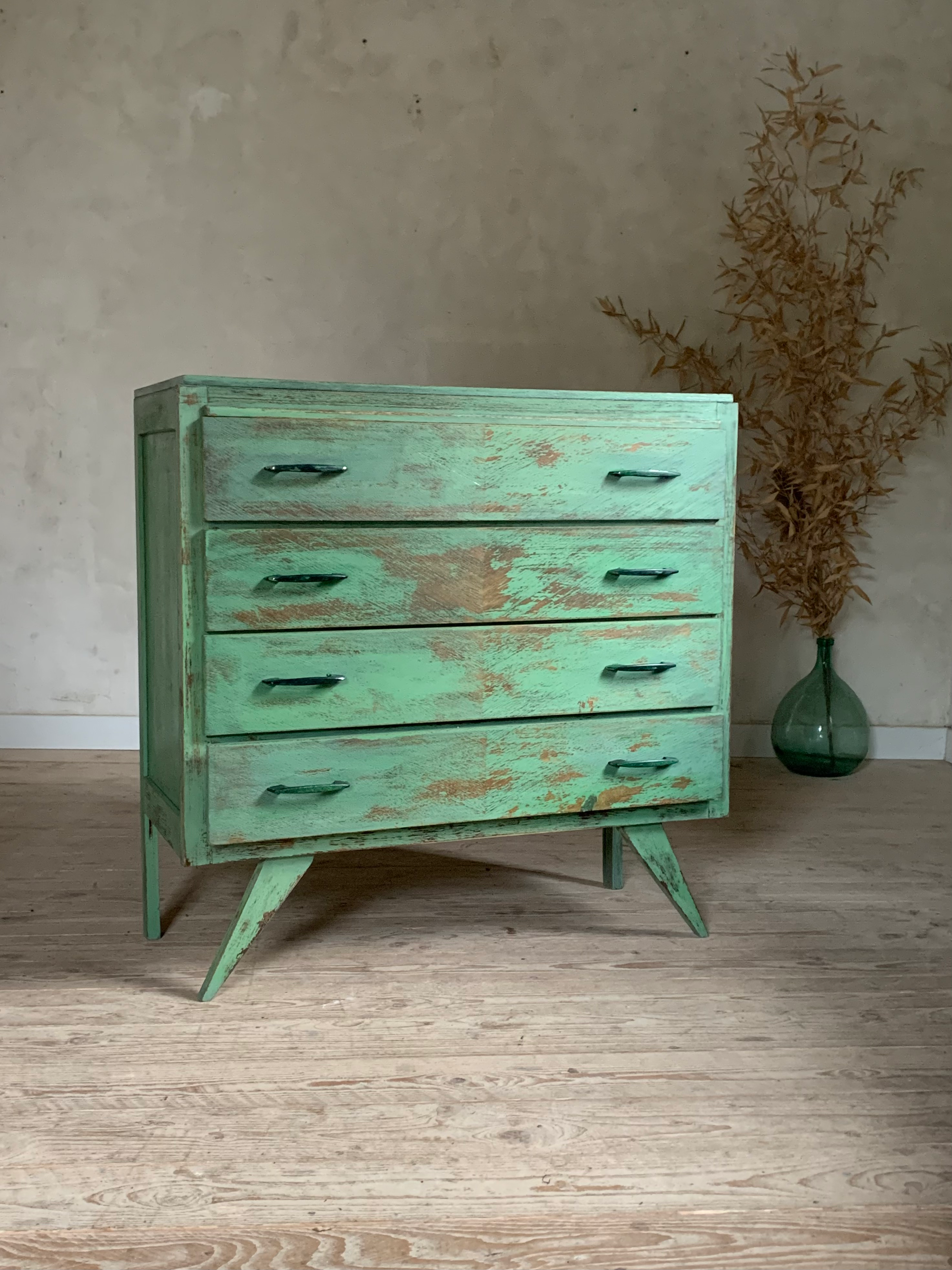 Vintage compass leg commode with a patina.
