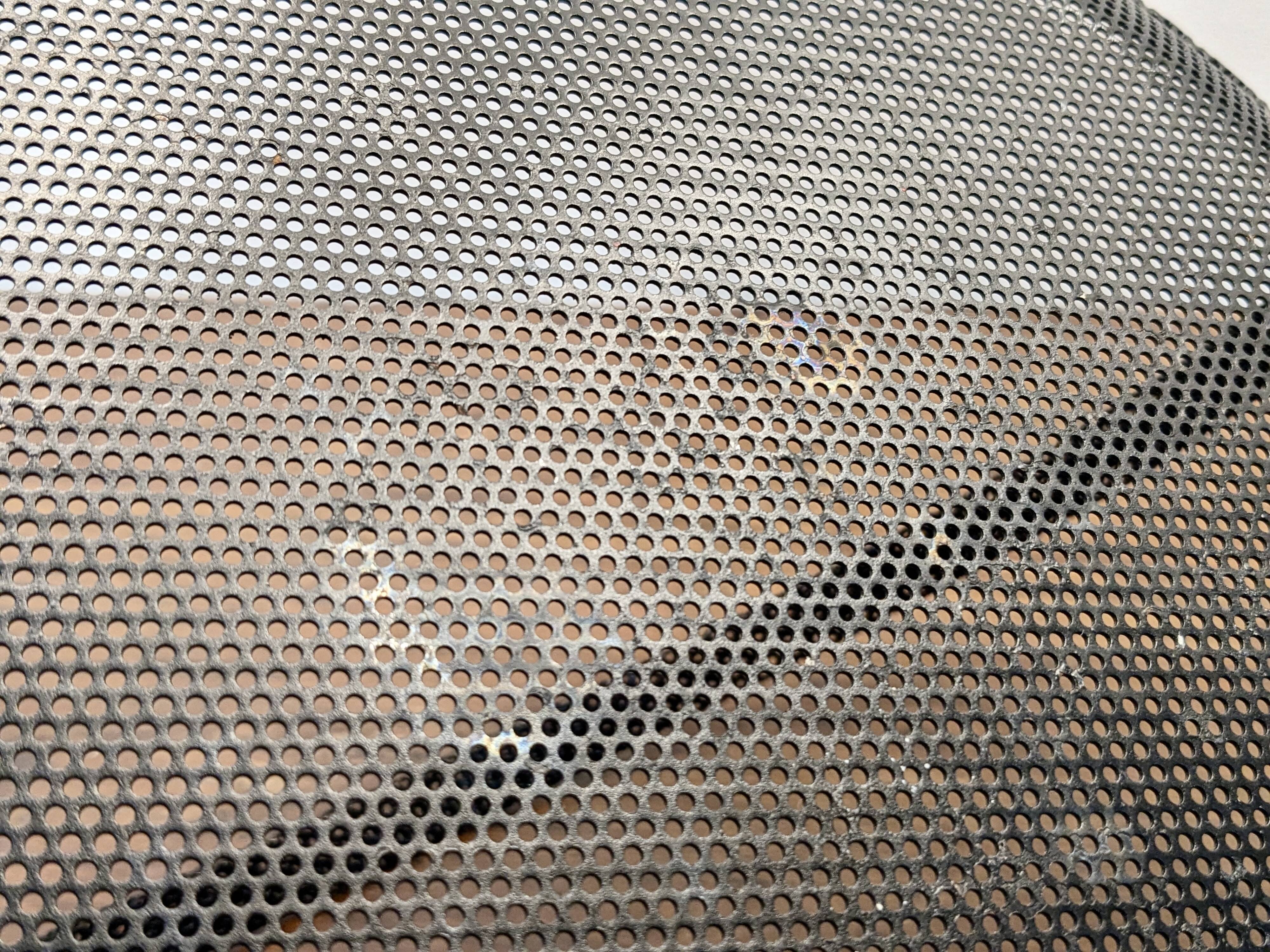 Black metal basket by Mathieu Mategot