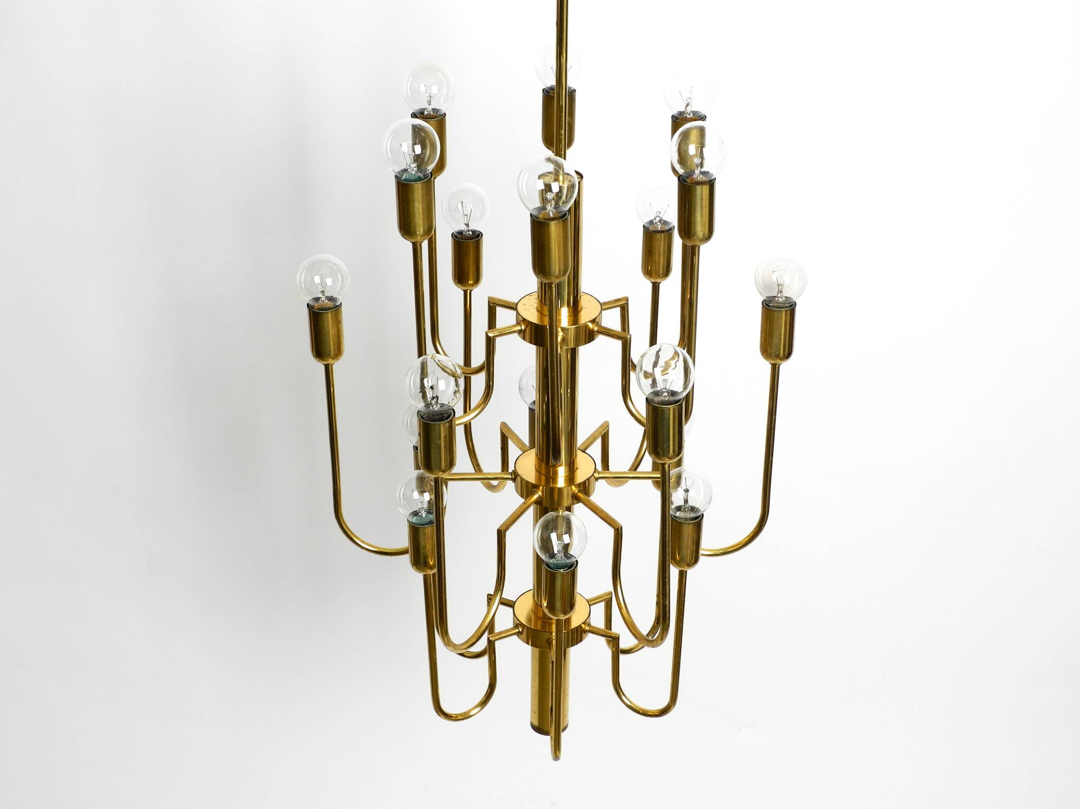 Three staged 18 arm Mid Century brass chandelier with a long brass rod
