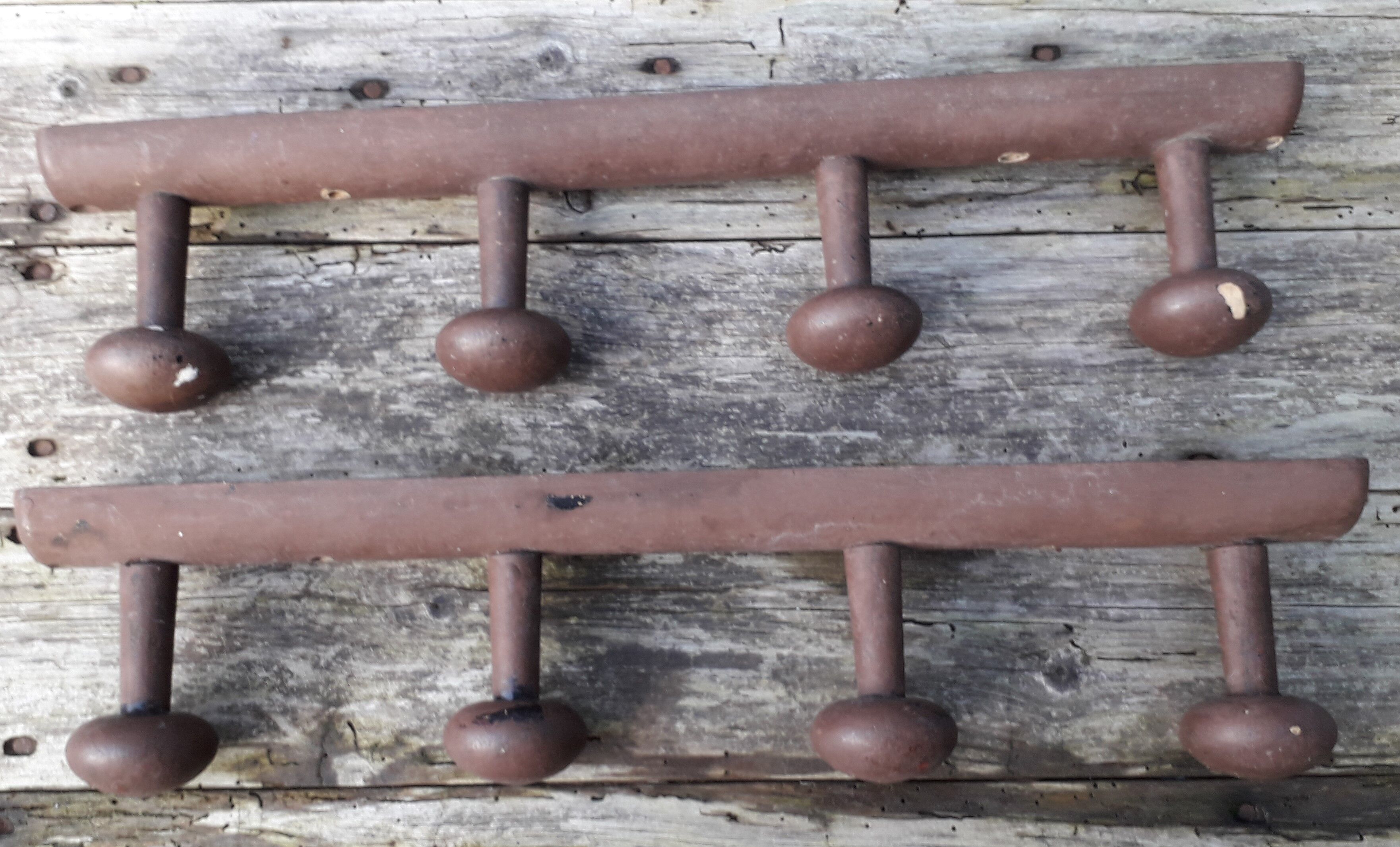 Pair of brown wooden coats