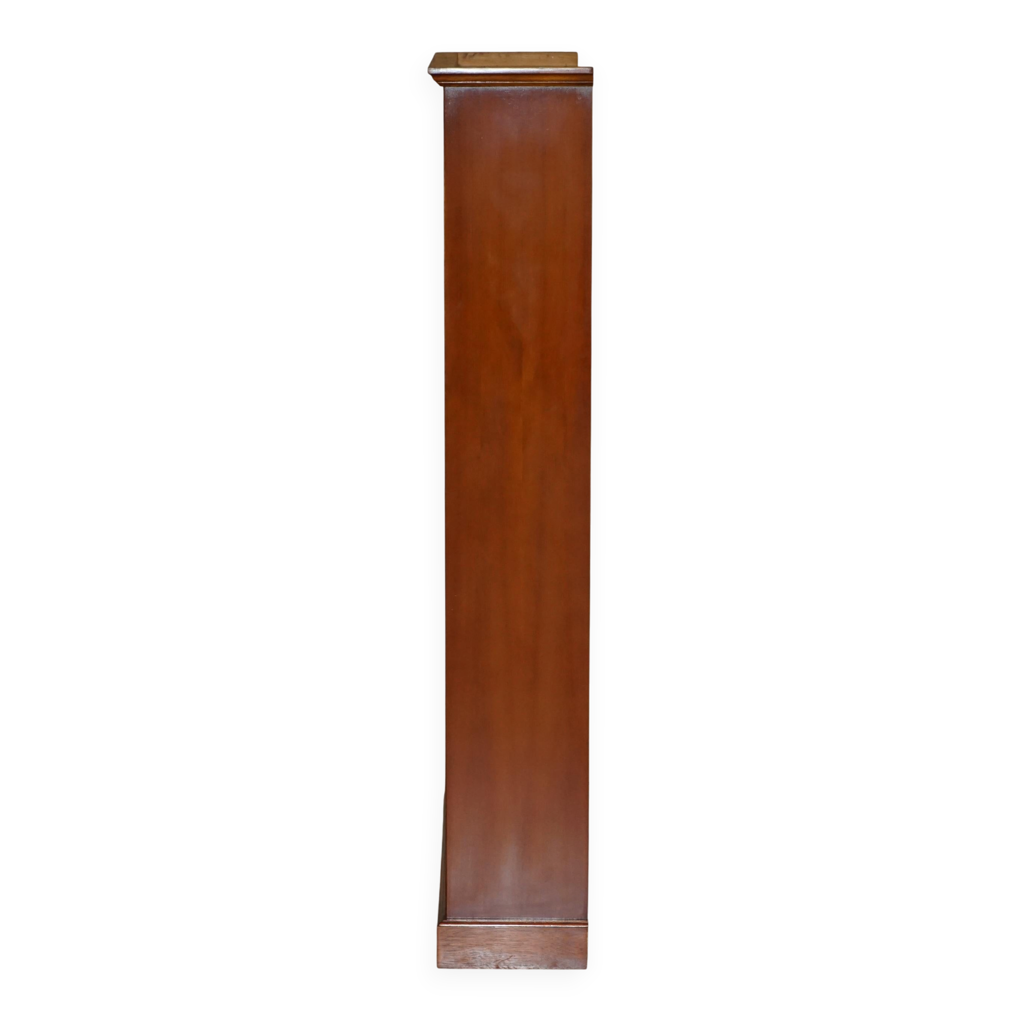Open library Bradley Furniture made of yew wood with a cupboard base.