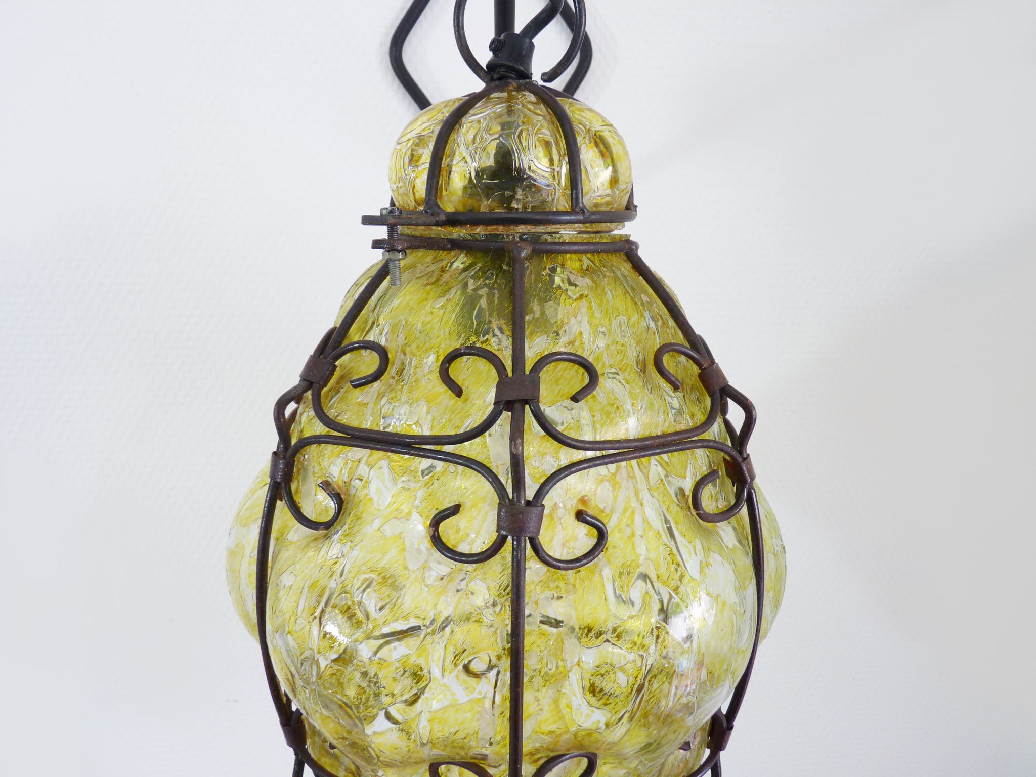 Italian vintage wall lamp in yellow blown glass and wrought iron. Year 70 80