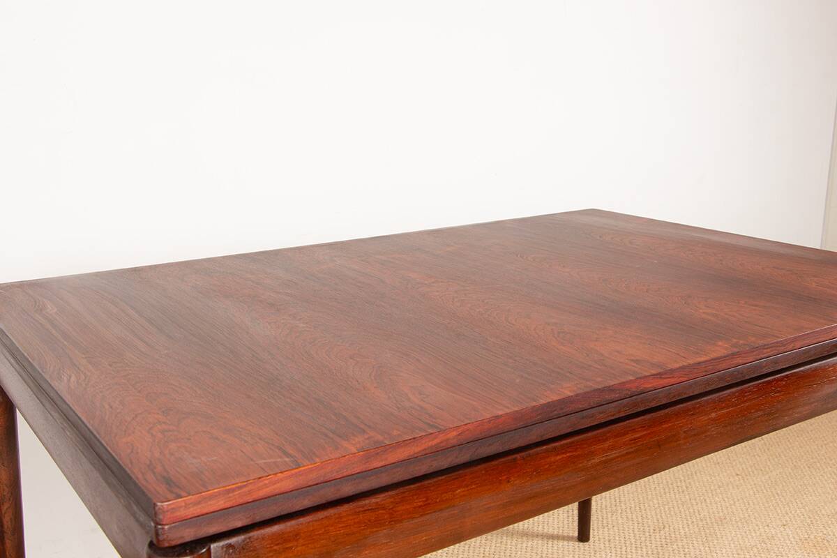 Danish extendable dining table in rosewood and brass by Poul Volther