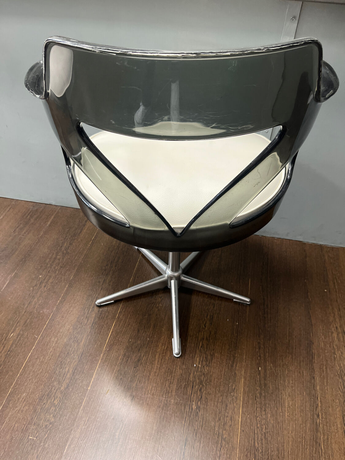 Old hairdressing chair and its footrest