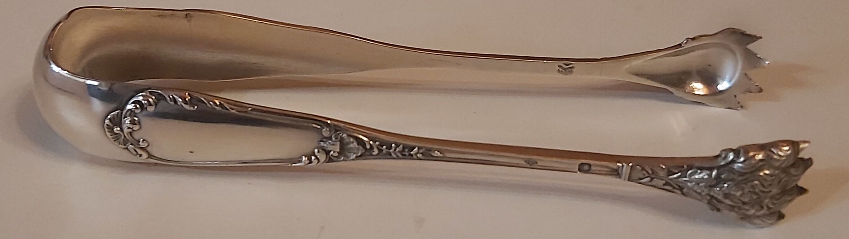 Solid silver sugar pliers neck brace