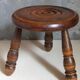 Low tripod stool in vintage turned solid wood
