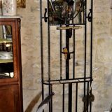 Wrought iron wardrobe with oval mirror