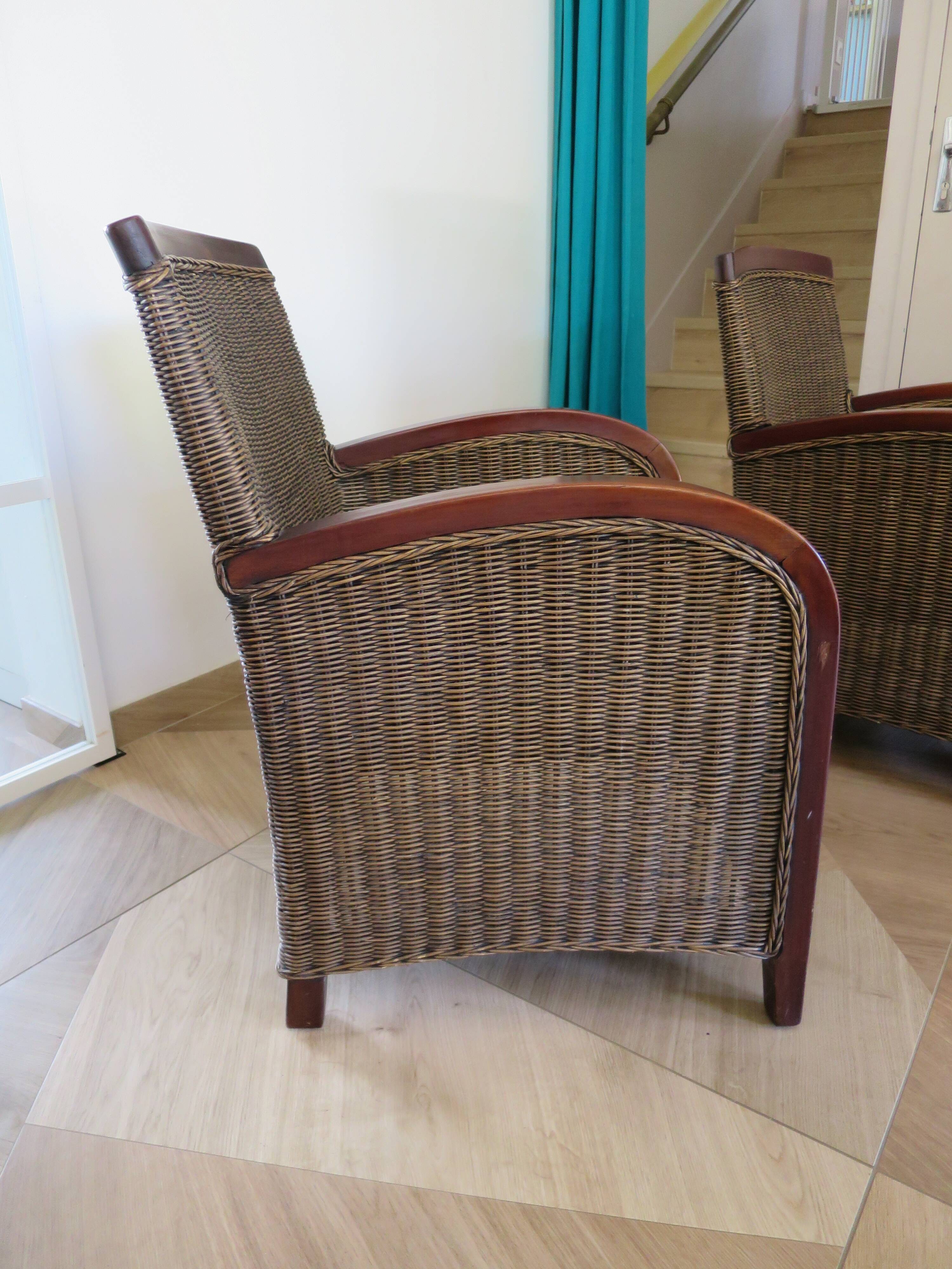 2 armchairs in woven rattan and wood, 1980s