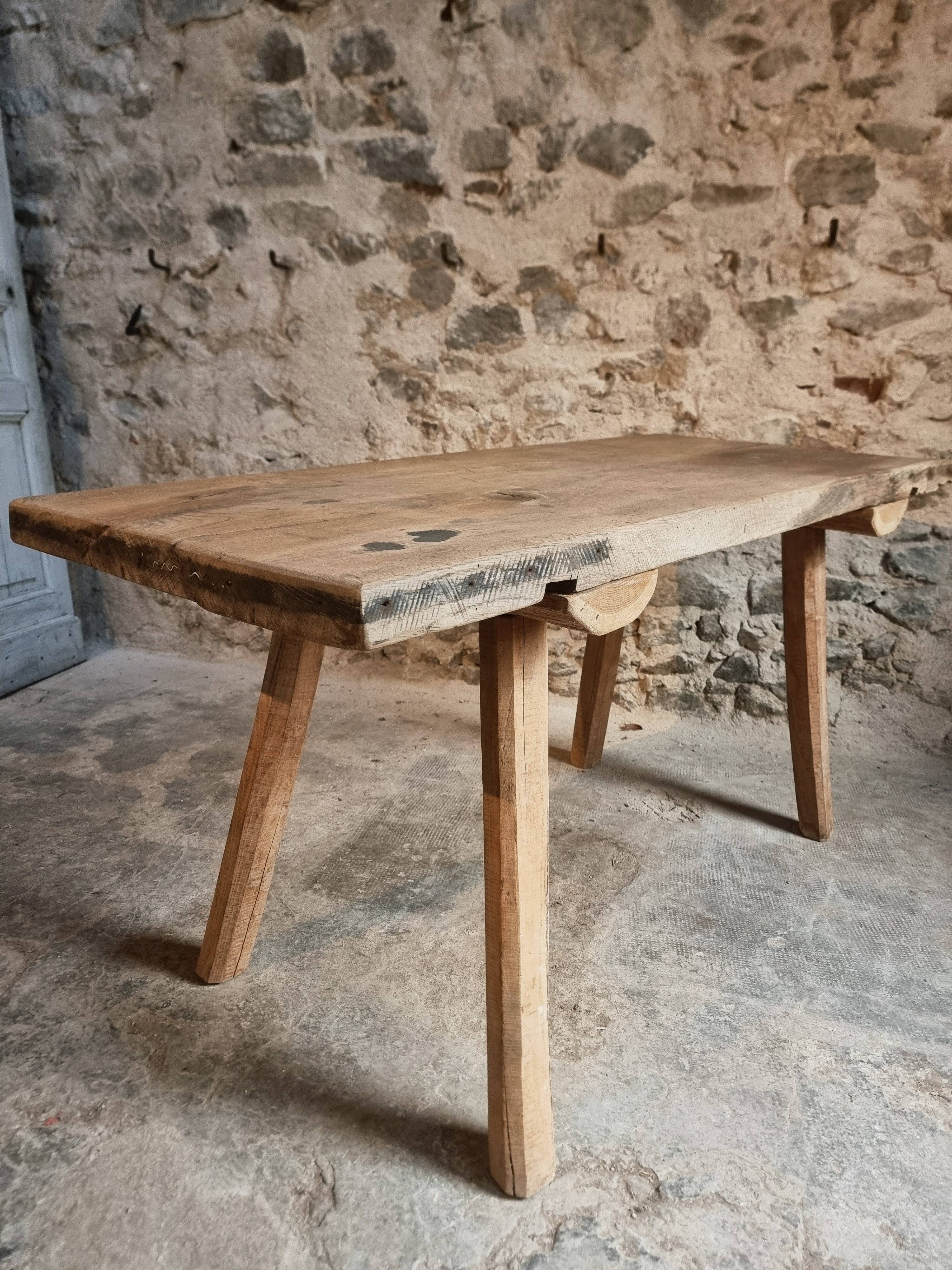 Antique work table / primitive dining table in oak, Hungary, circa 1900–1930.
