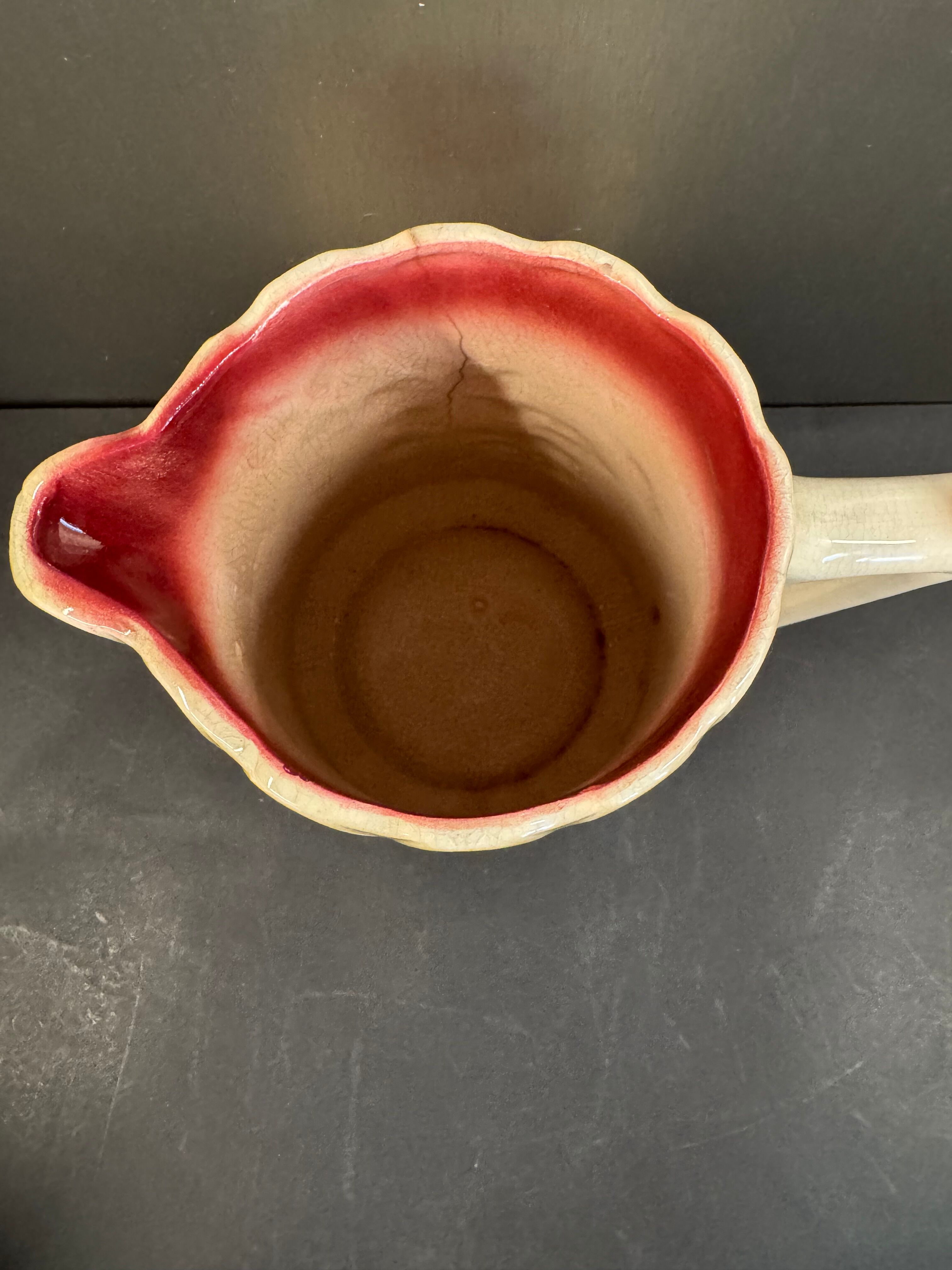 Antique pitcher in slipware with floral decoration – red and cream floral design