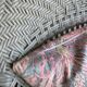 Vintage wicker lounge chair with pastel cushions – 1980s