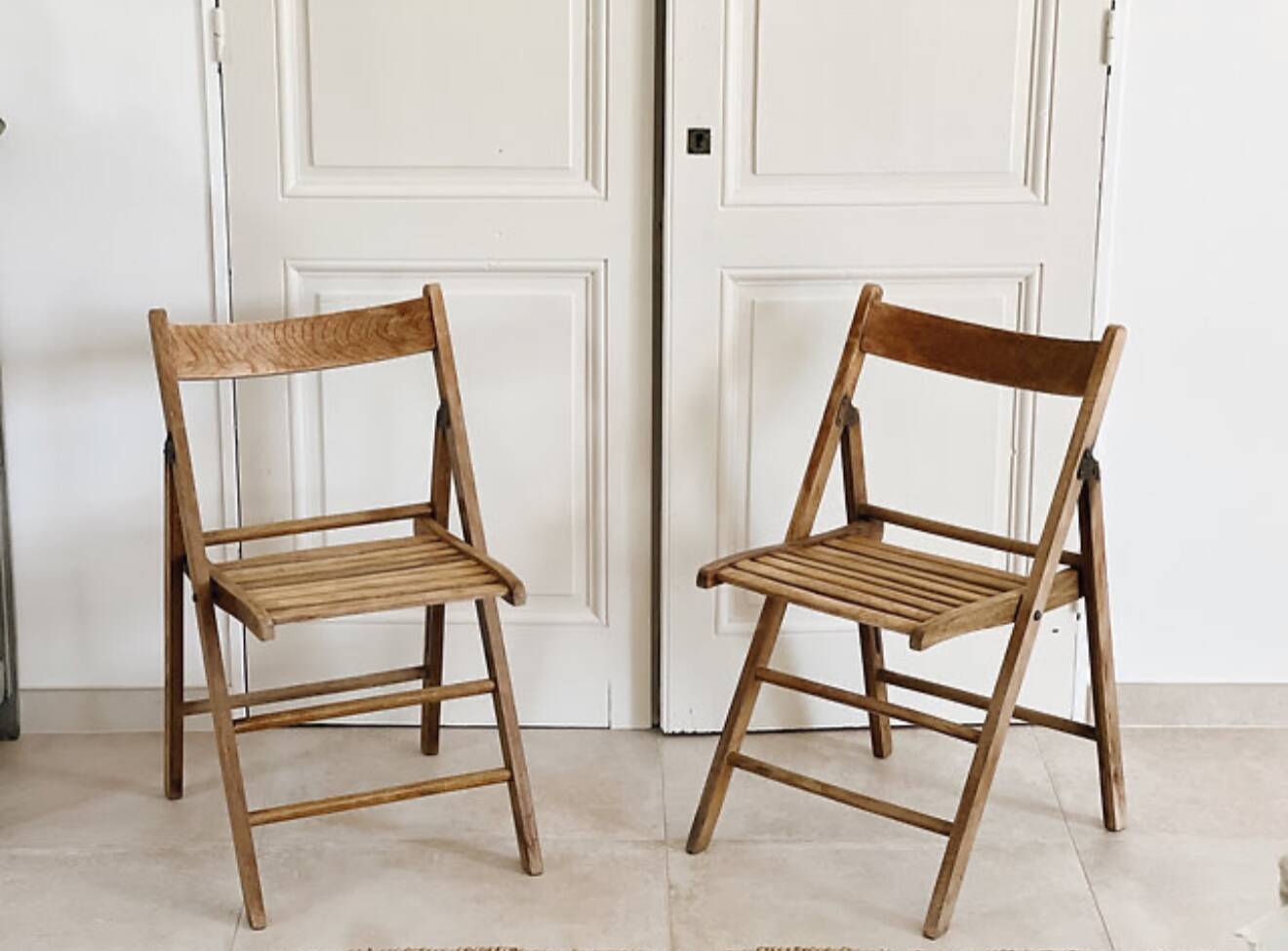 Pair of folding wooden chairs